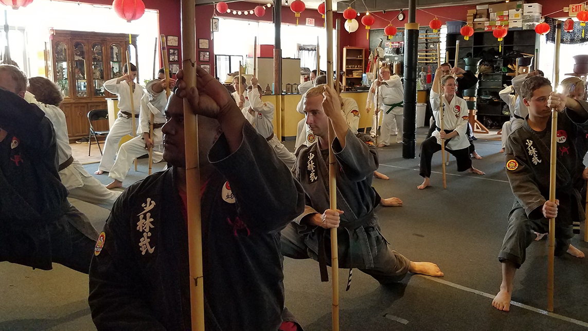 students train with bamboo staff
